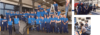 Eine Gruppe von Personen in passenden blauen Uniformen posiert gemeinsam in einer Werkstattumgebung, möglicherweise ein Team von Mechanikern oder Technikern mit einem Gefühl der Kameradschaft.
