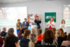 FALG-Kongress 2026 in Köln: Markus Stier auf der Bühne vor Publikum bei Fachvortrag zur Entgeltabrechnung